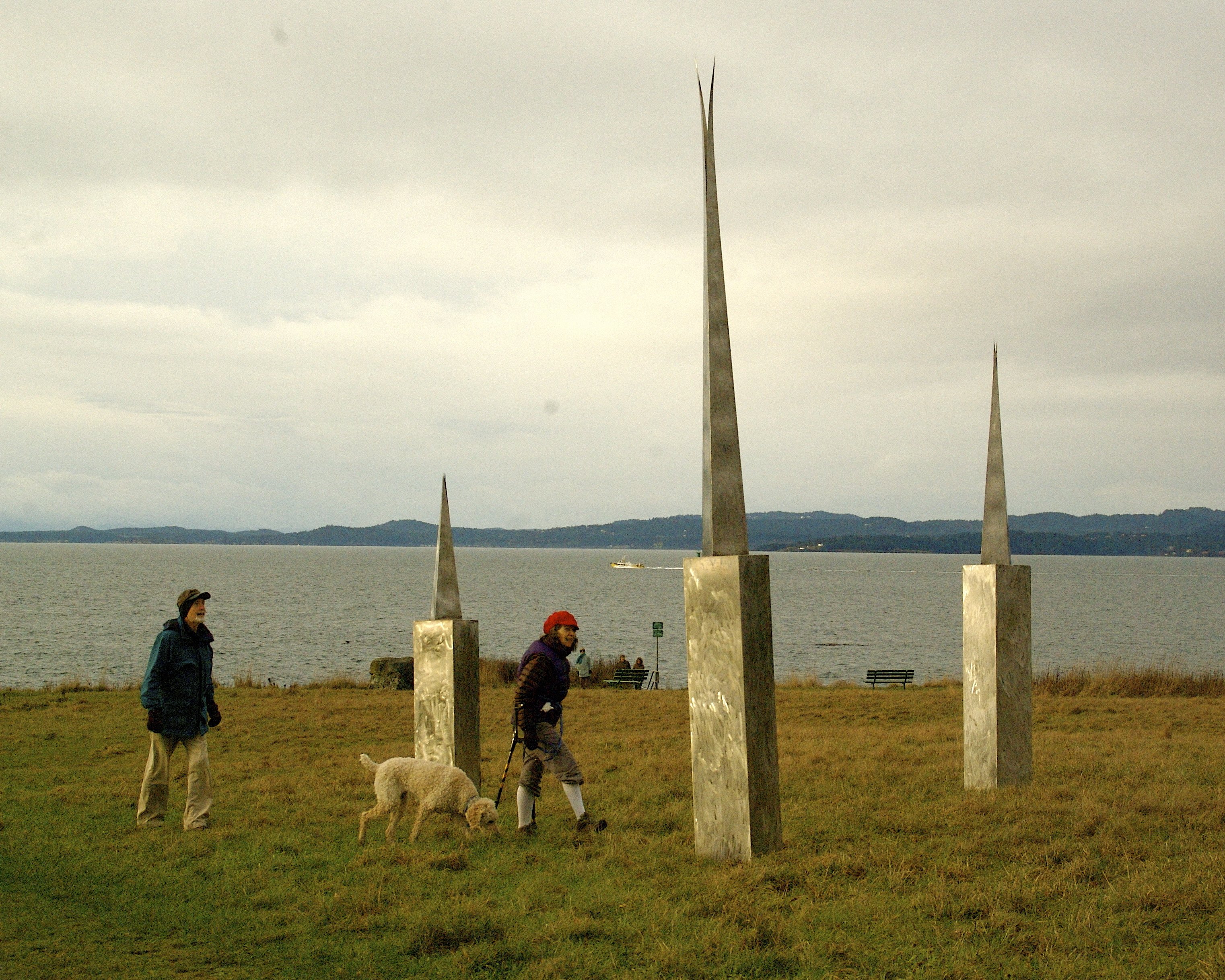 Picture of sculpture showing people beside it for scale.